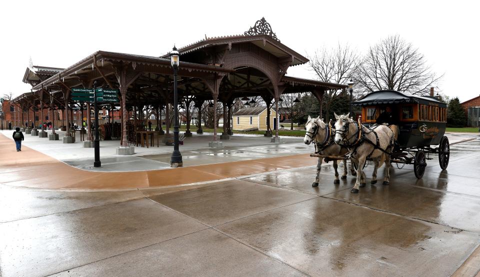 A horse carriage passes by the historic Detroit Central Market at Greenfield Village on Friday, April 15, 2022. Members got their first look at the market before its official reopening on Saturday, April 16th.
