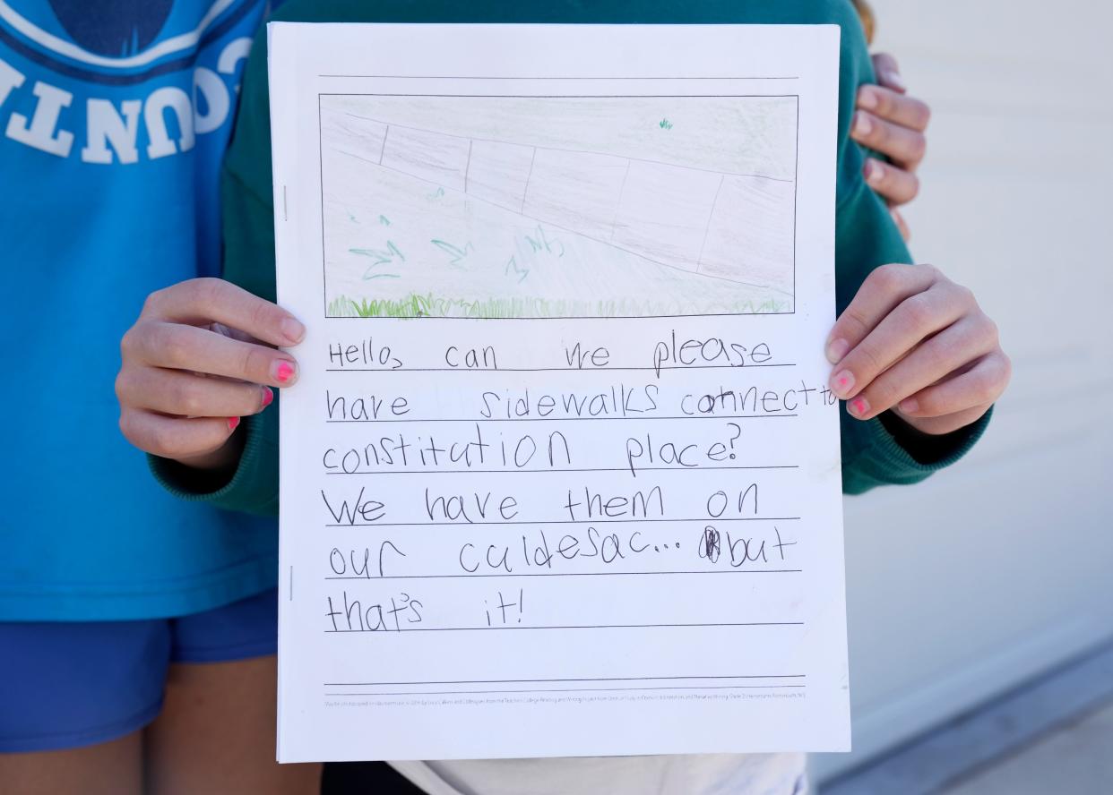 Sisters Lucy Honigford, 10, and Hazel Honigford, 8, created a book, asking the city of Columbus to put sidewalks in their neighborhood on the Northwest Side. The girls expressed their frustration, with one of them writing: u0022It makes me sad that I can't go further with my family. Crossing a busy street and riding (a bike) into the grass is very hard.u0022