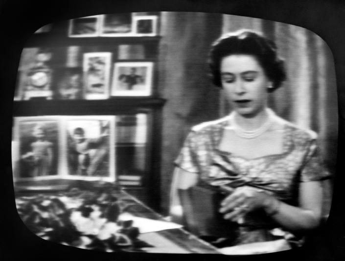 File photo dated December 1957 of Queen Elizabeth II seated at her desk in the Long Library at Sandringham for the traditional Christmas Day broadcast which was televised that year for the first time and carried by both the BBC and ITV. The Queen's life was steeped in tradition, but she kept up with the vast technological advances that occurred during her reign. She saw the advent of popular colour television, mobile phones, the internet and social media and held audiences and meetings over video conference. Issue date: Thursday September 8, 2022.