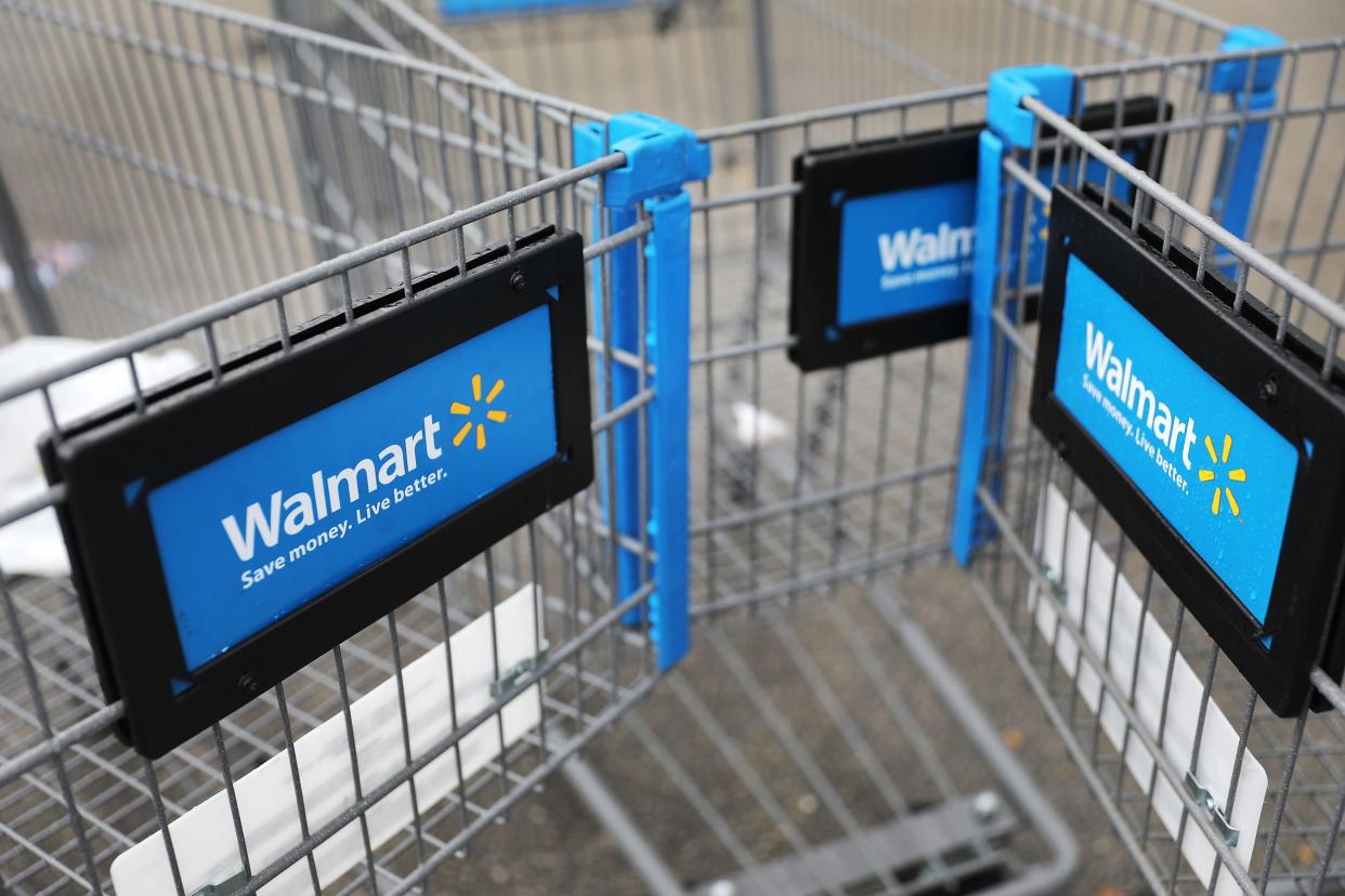 Walmart carts are seen outside of a store as the company reported fiscal fourth-quarter earnings that fell short of analysts’ estimates on February 18, 2020 in Miami, Florida.