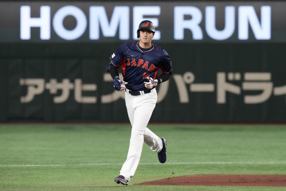 Shohei Ohtani of Japan rounds the bases after hitting a 3-run home run in the 1rst inning against Australia during their Pool B game at the World Baseball Classic at the Tokyo Dome Sunday, March 12, 2023, in Tokyo. (AP Photo/Eugene Hoshiko)