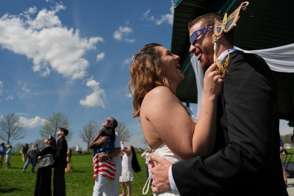 Gerald Lester, right, dances with his new wife, Samantha Palmer, following a wedding ceremony during a total solar eclipse