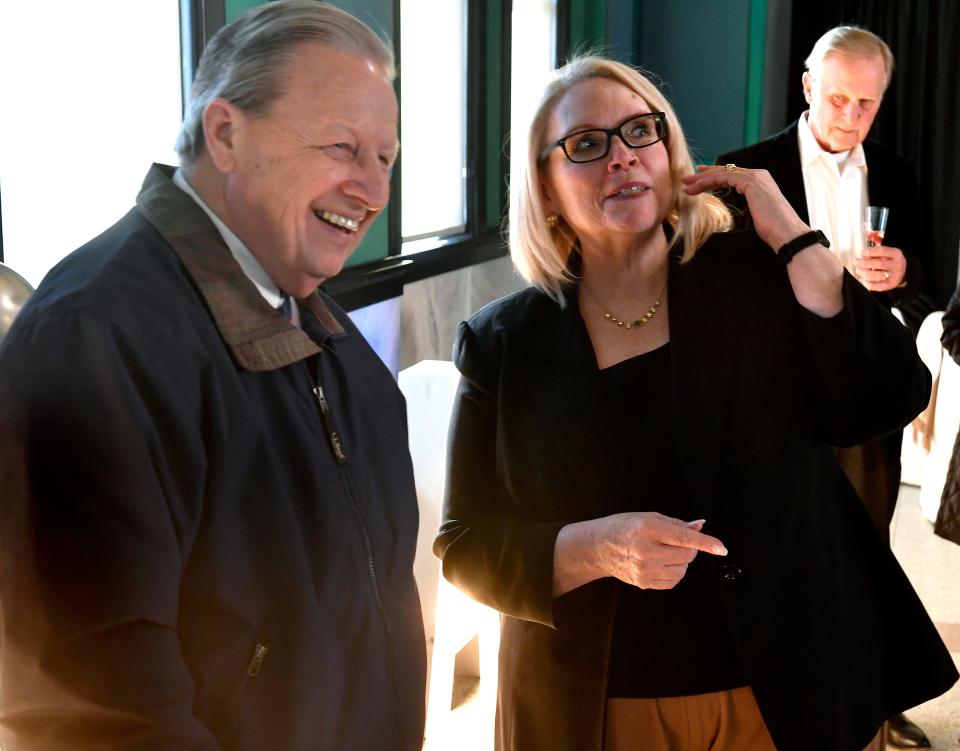 Taylor County Judge Downing Bolls shares a moment with Mary Cooksey during her retirement party Jan. 27 at the Grace Museum. Cooksey was the former director of United Way's 2-1-1: A Call for Help.