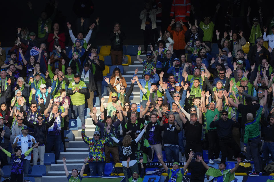 Fans cheer their team during the FIFA Club World Cup soccer match between Seattle Sounders FC and Al Ahly FC at the Tangier stadium, in Tangier, Morocco, Saturday, Feb. 4, 2023. (AP Photo/Mosa'ab Elshamy)