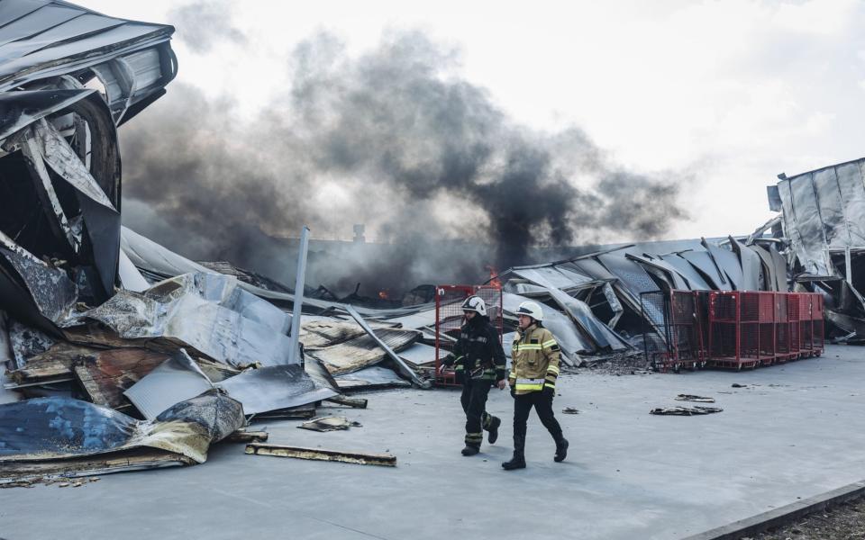 Firefighters work at a factory destroyed after it was hit by Russian shellings in Chaiky district of Kyiv, Ukraine -  Diego Herrera Carcedo/Anadolu Agency via Getty Images