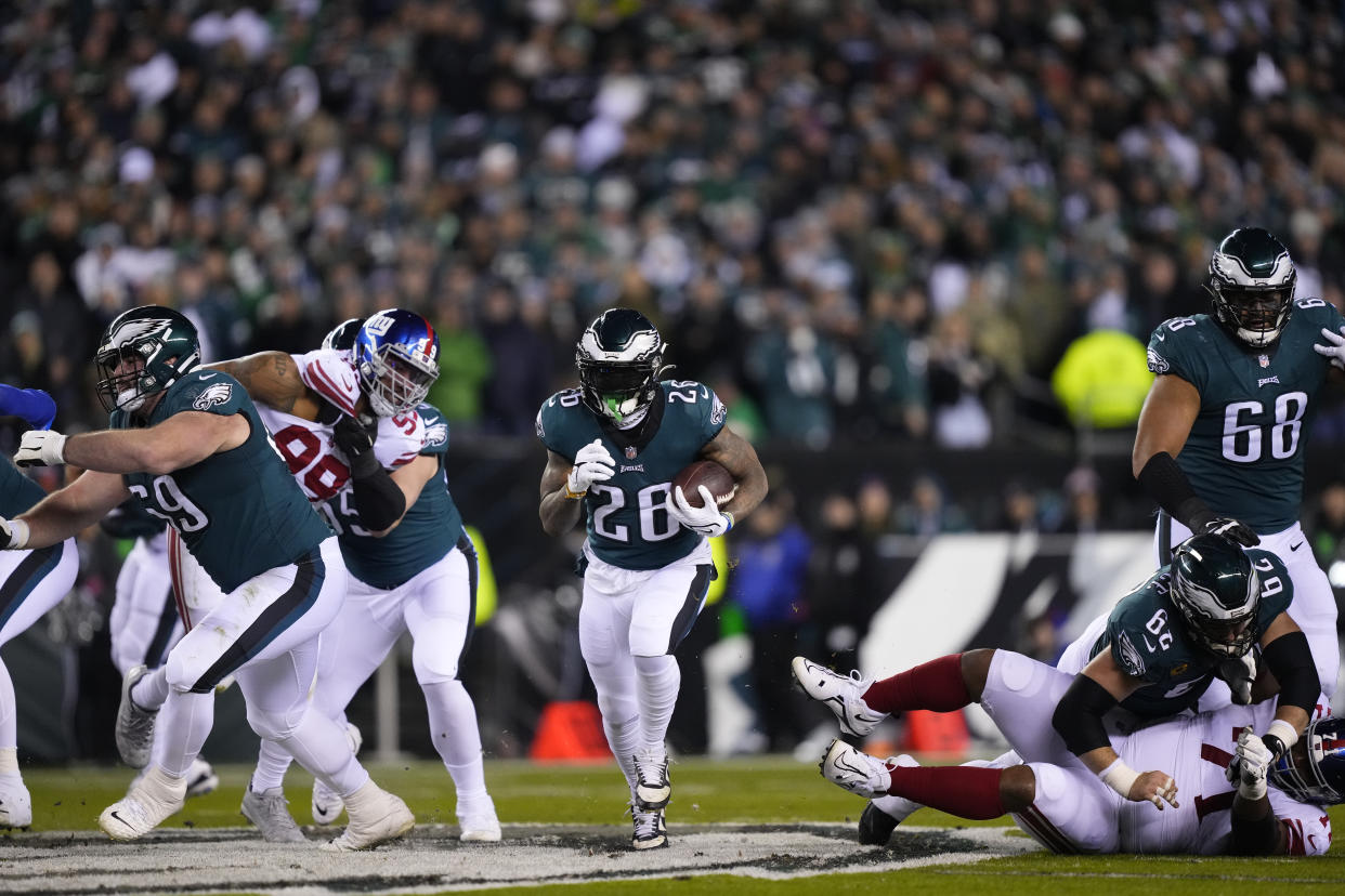 Philadelphia Eagles running back Miles Sanders runs through a huge hole in a divisional playoff game against the Giants. (AP Photo/Matt Rourke)