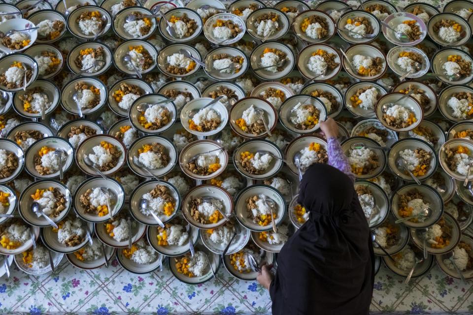 <span class="caption">A woman preparing the meal for breaking the Ramadan fast at sundown.</span> <span class="attribution"><a class="link " href="https://www.shutterstock.com/image-photo/woman-preparing-menu-break-fast-648524467" rel="nofollow noopener" target="_blank" data-ylk="slk:Isvara Pranidhana/Shutterstock.com;elm:context_link;itc:0;sec:content-canvas">Isvara Pranidhana/Shutterstock.com</a></span>