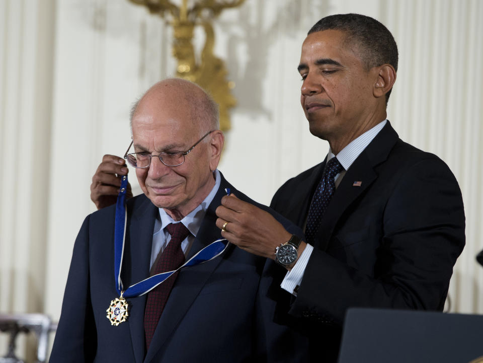 FILE - President Barack Obama awards psychologist Daniel Kahneman with the Presidential Medal of Freedom, Nov. 20, 2013, during a ceremony in the East Room of the White House in Washington. Kahneman, a psychologist who won a Nobel Prize in economics for his insights into how ingrained neurological biases influence decision making, died Wednesday, March 27, 2024, at the age of 90. (AP Photo/Evan Vucci, File)