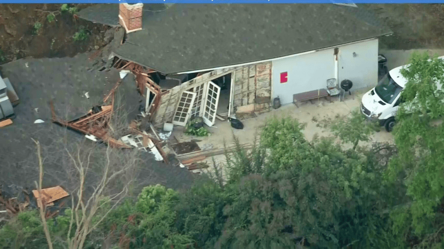 A home is red tagged after a mudslide in Sherman Oaks on March 13, 2024. (KTLA)