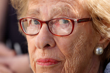 Auschwitz survivor Eva Schloss, stepsister of Holocaust diarist Anne Frank, listens to Chabad Rabbi Reuven Mintz at Newport Harbor High School after speaking with a group of students seen in viral online photos giving Nazi salutes over a swastika made of red cups that sparked outrage in Newport Beach, California, U.S., March 7, 2019. REUTERS/Mike Blake