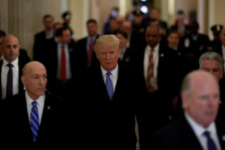 U.S. President Donald Trump departs following a Congressional Gold Medal ceremony for former Senator Bob Dole at the U.S. Capitol in Washington, U.S., January 17, 2018. REUTERS/Aaron P. Bernstein