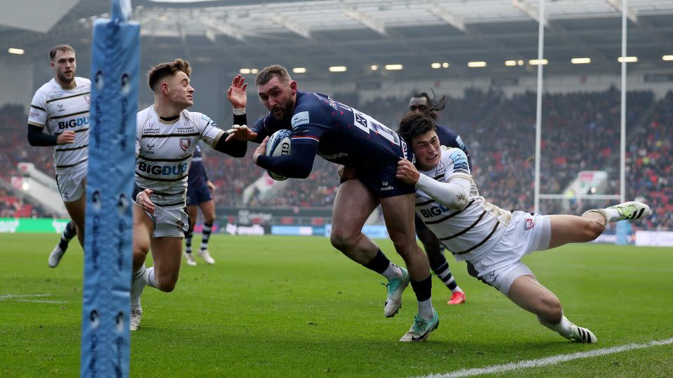 Rees-Zammit makes a tackle while playing for Gloucester. - Ryan Hiscott/Getty Images