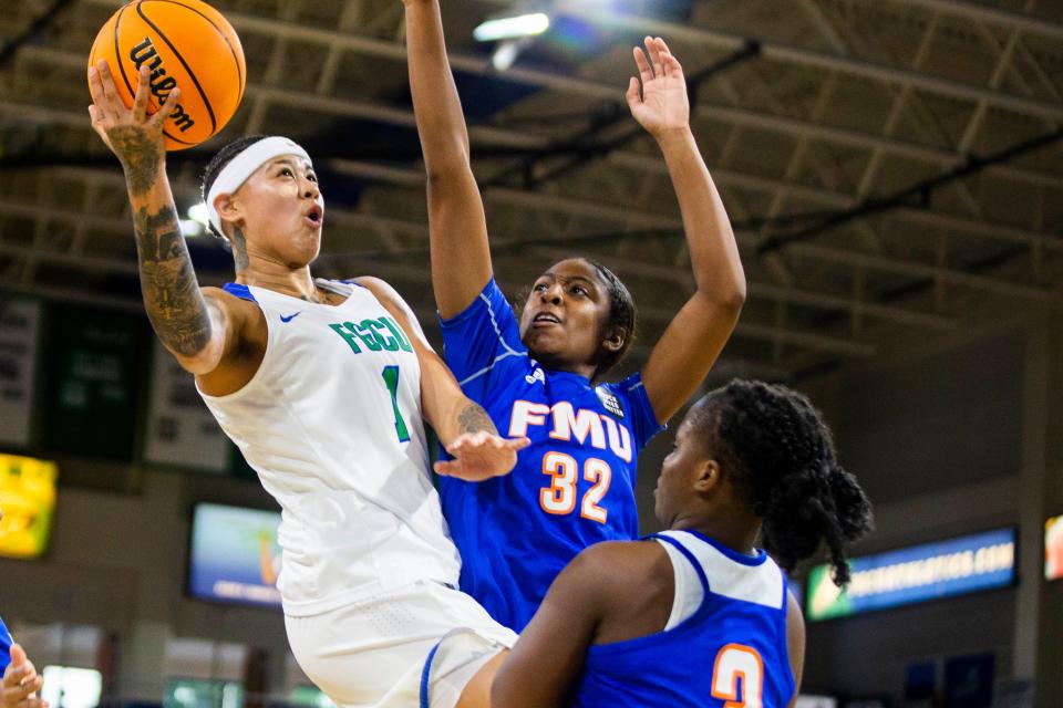 FGCU's Kierstan Bell goes up for a shot against FMU, Nov. 9, 2021 at the Alico Arena in Fort Myers, Fla.