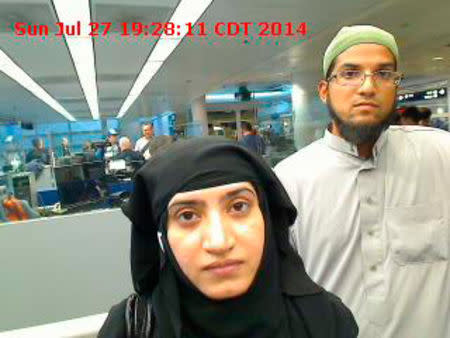 Tashfeen Malik, (L), and Syed Farook are pictured passing through Chicago's O'Hare International Airport in this July 27, 2014 handout photo obtained by Reuters December 8, 2015. REUTERS/US Customs and Border Protection/Handout via Reuters