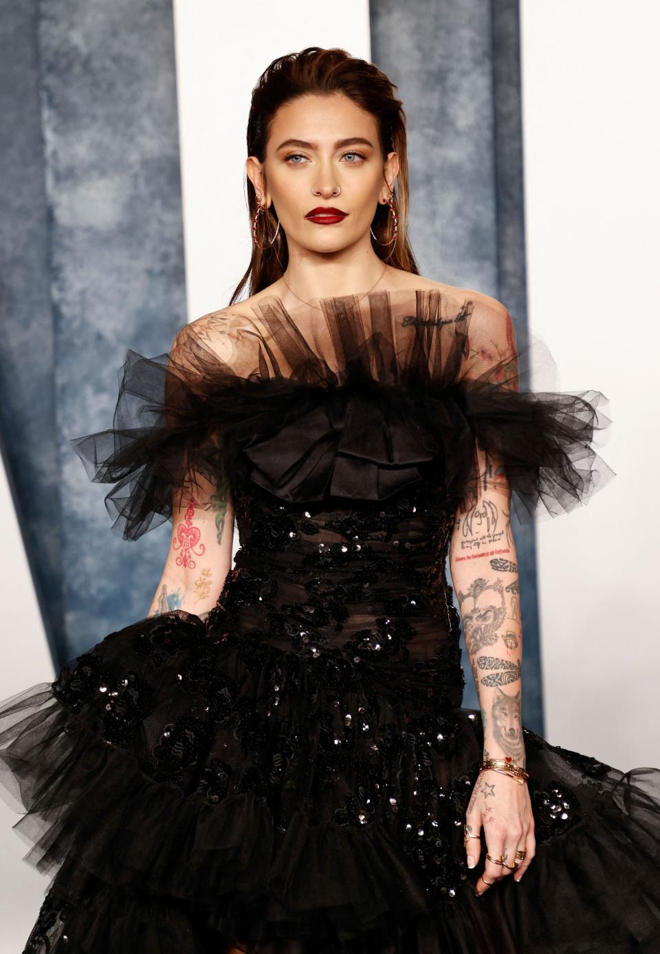 Paris Jackson covered up her more than 80 tattoos for her Grammys look.