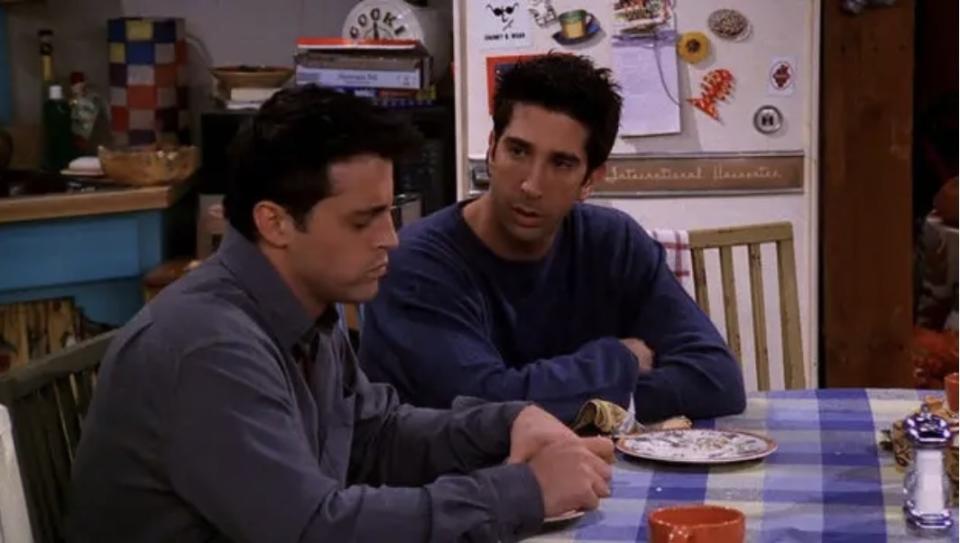 Joey and Ross sitting at a table