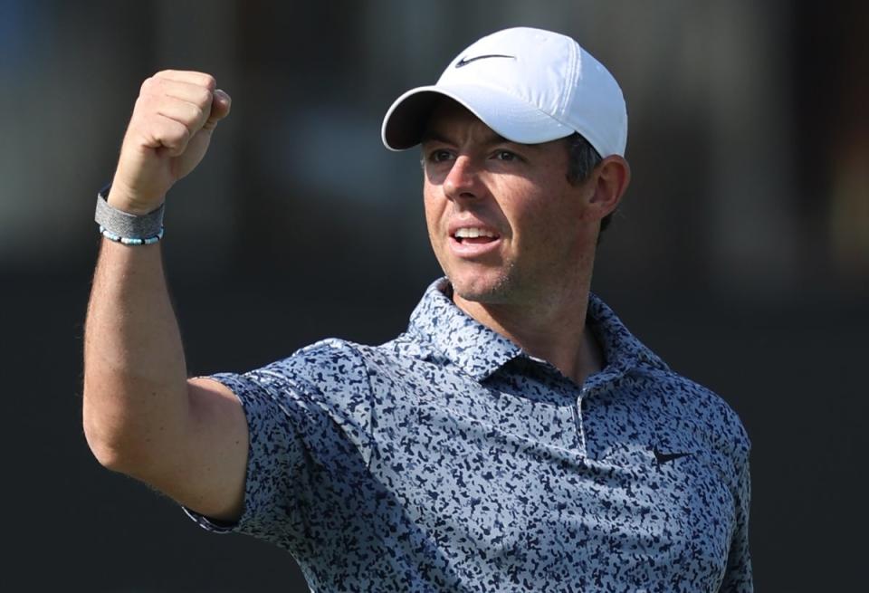 Rory McIlroy of Northern Ireland celebrates after winning the Hero Dubai Desert Classic 2023 Golf tournament (EPA)