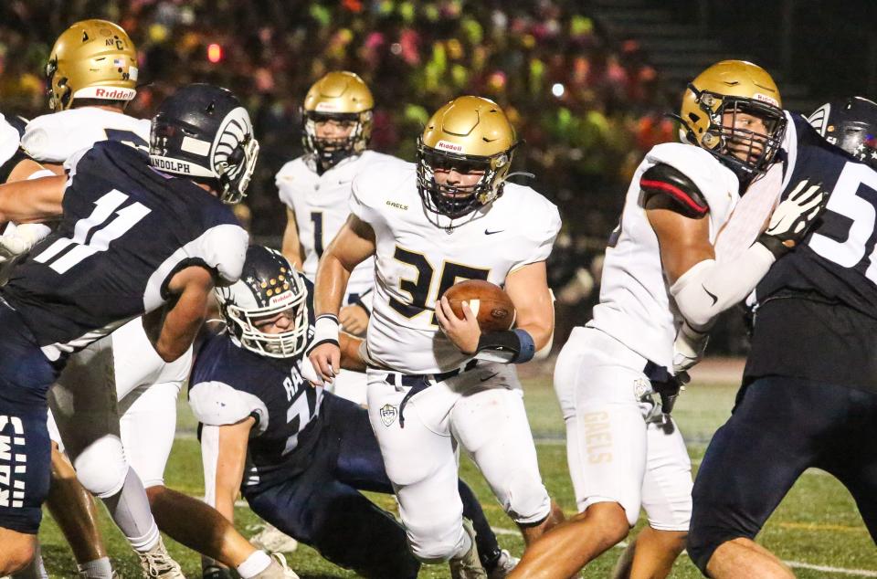 Roxbury's Matthew Rattay runs the ball during the first half of a football game at Randolph High School on September 8, 2023.