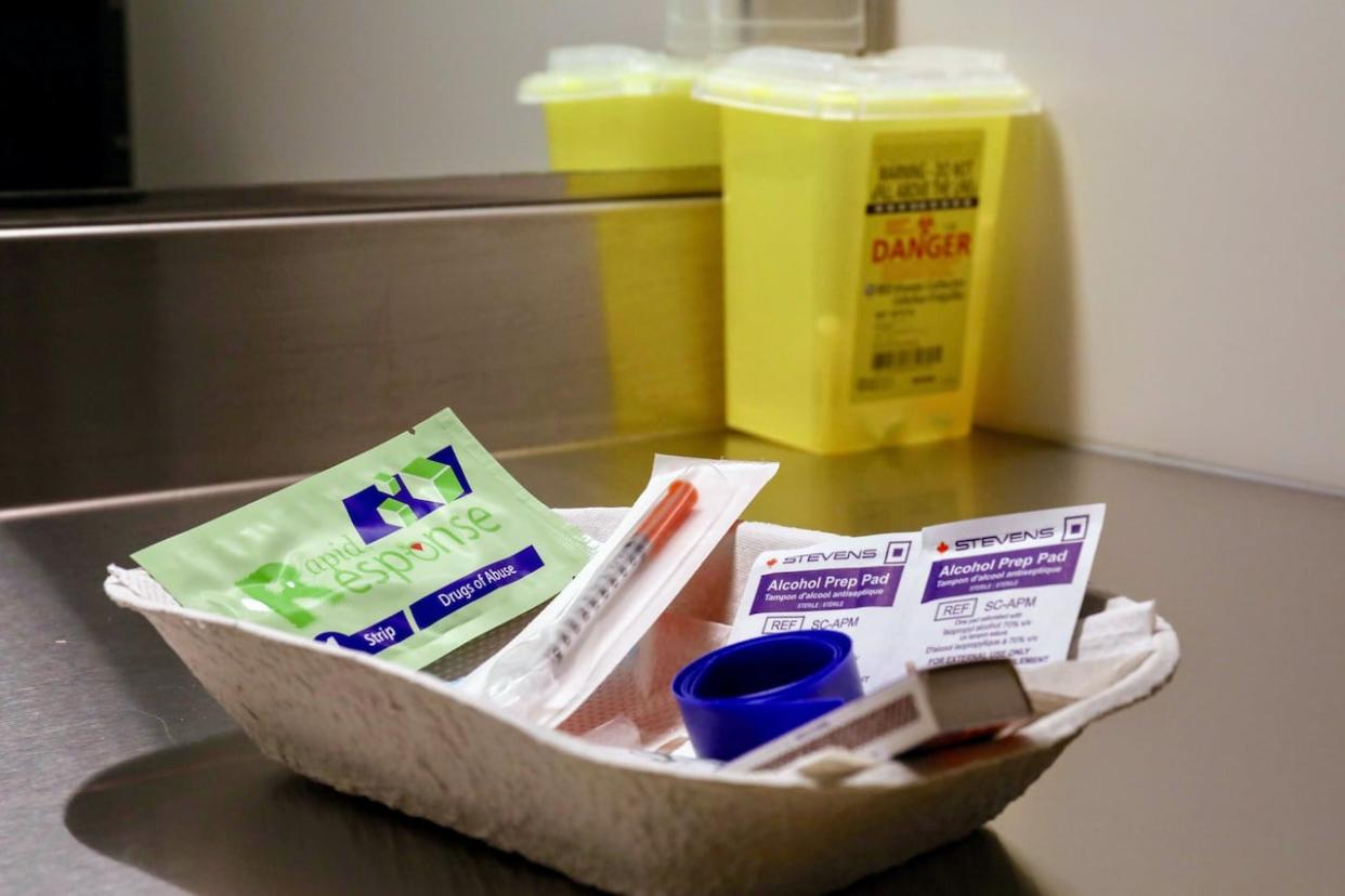 A dish of sterile needles, alcohol swabs, and drug test strips at one of B.C.'s 33 official overdose prevention and supervised consumption sites, where drug users can access clean supplies and receive quick care if they experience an overdose. P.E.I. and Newfoundland and Labrador are the only provinces without such a site. (Michael McArthur/CBC - image credit)