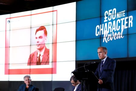 Bank of England governor Mark Carney presents the image of mathematician Alan Turing who will appear on a new 50 pound note at at the Science and Industry Museum in Manchester