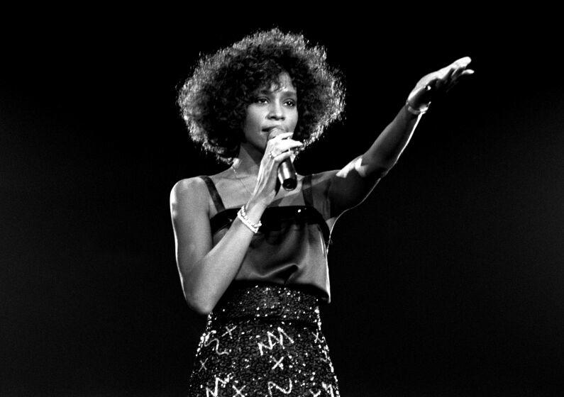 Whitney Houston performing on stage