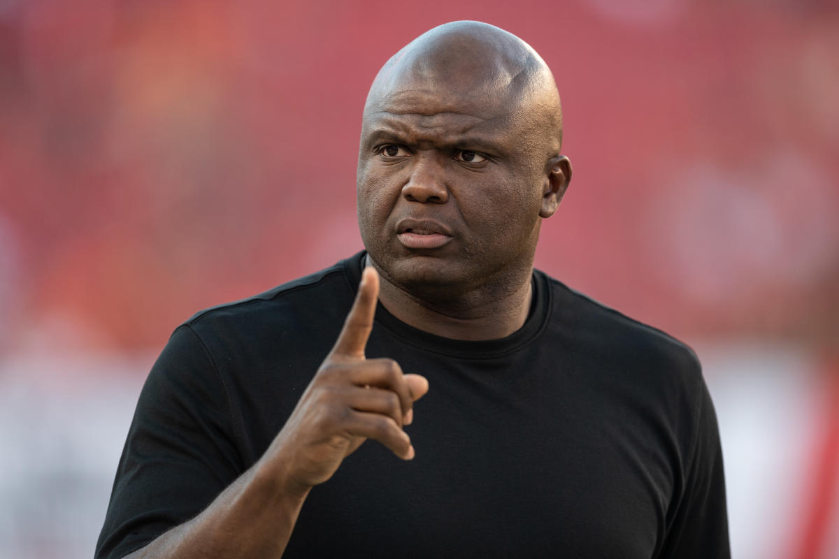 TV Analyst Booger McFarland looks on the sideline during an NFL