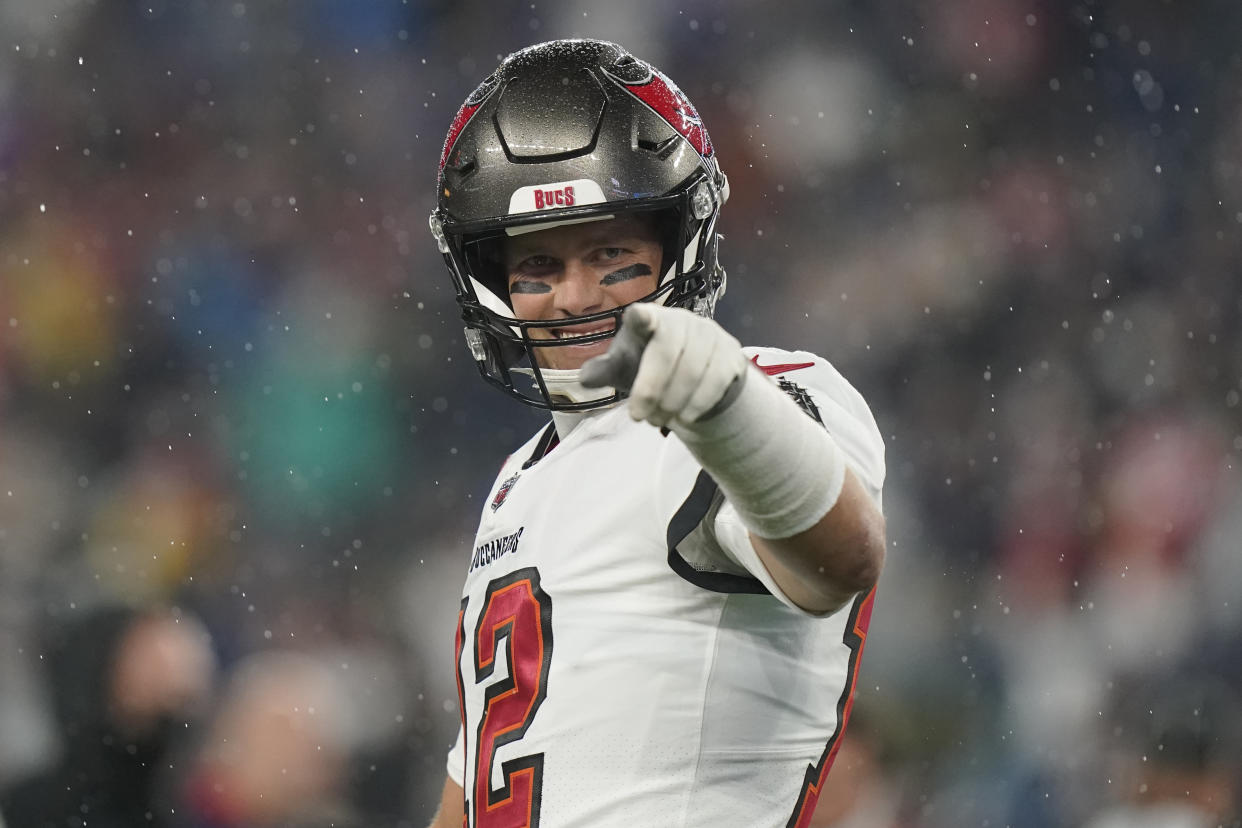 Tampa Bay Buccaneers quarterback Tom Brady (12) points toward the sidelines prior to an NFL football game between the New England Patriots and Tampa Bay Buccaneers, Sunday, Oct. 3, 2021, in Foxborough, Mass. (AP Photo/Steven Senne)