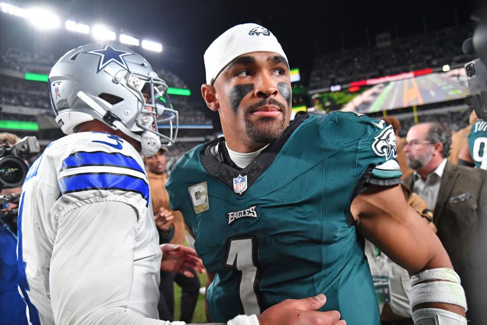 Nov 5, 2023; Philadelphia, Pennsylvania, USA; Dallas Cowboys quarterback Dak Prescott (4) and Philadelphia Eagles quarterback Jalen Hurts (1) meet on the field after the Eagles win at Lincoln Financial Field. Mandatory Credit: Eric Hartline-USA TODAY Sports