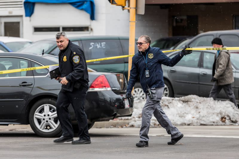 Police investigate a shooting at the Molson Coors headquarters in Milwaukee, Wisconsin