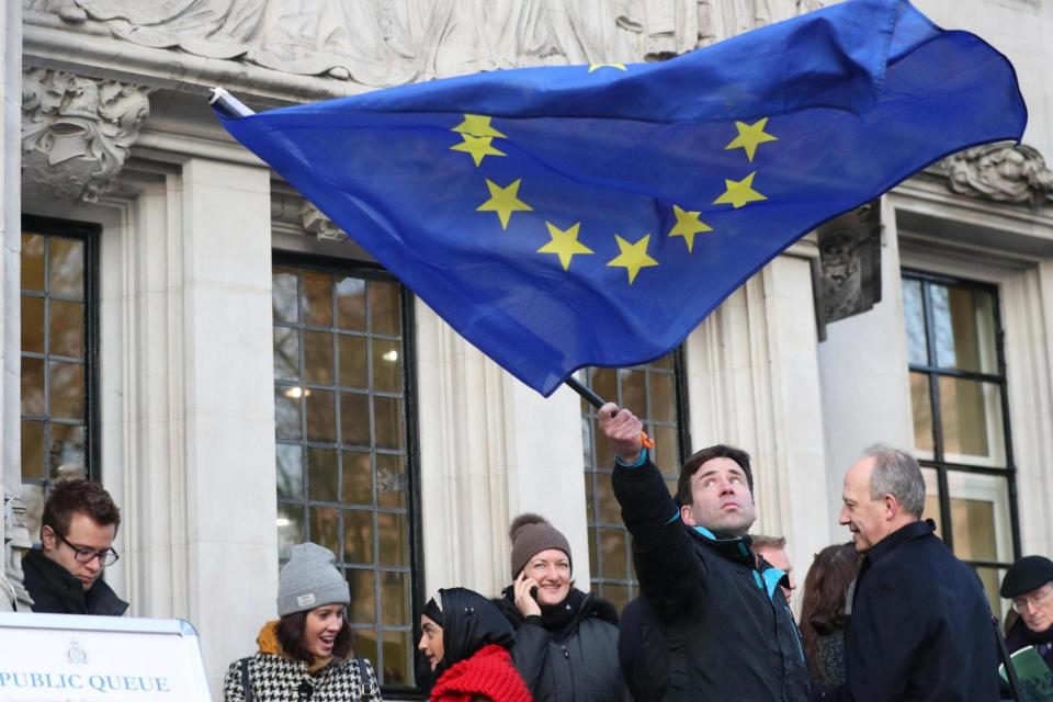 A protester waves an EU flag outside the Supreme Court on the day of the Brexit ruling earlier this month. (PA)