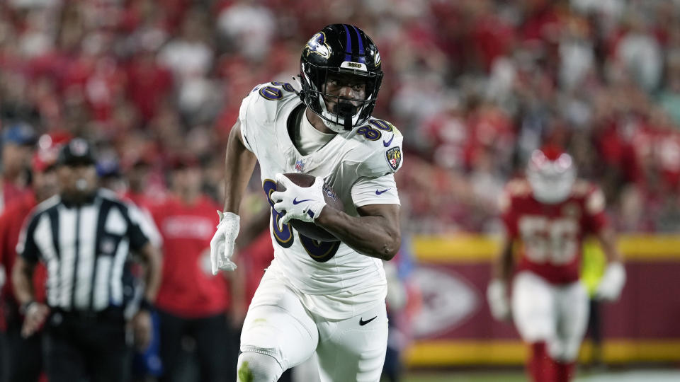 Baltimore Ravens tight end Isaiah Likely, right, walks into the end zone after catching a pass for a touchdown during the second half of an NFL football game against the Kansas City Chiefs on Thursday, Sept. 5, 2024, in Kansas City, Missouri. (AP Photo/Ed Zurga)