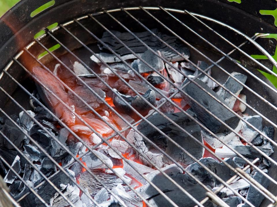 Charcoal grill with burning coals