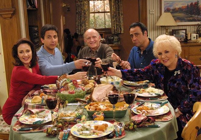 The dysfunctional Barone clan at Thanksgiving dinner in an episode of Everybody Loves Raymond: Patricia Heaton, left, Ray Romano, Peter Boyle, Brad Garrett and Doris Roberts.