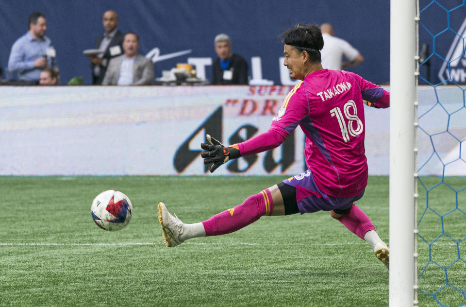 Vancouver Whitecaps goalkeeper Yohei Takaoka tries to make a save against the Houston Dynamo during the first half of an MLS soccer match Wednesday, May 31, 2023, in Vancouver, British Columbia. (Rich Lam/The Canadian Press via AP)