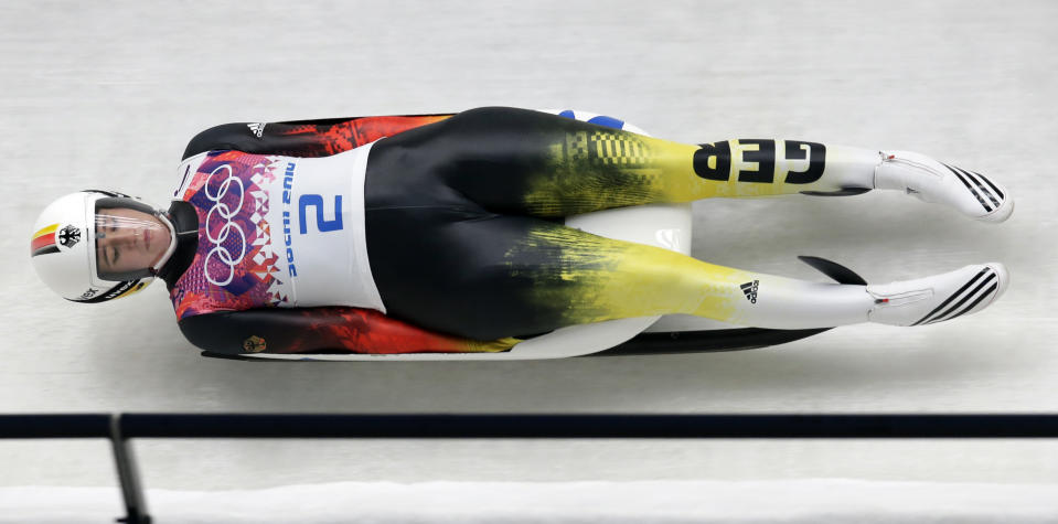 Natalie Geisenberger of Germany speeds down the track in her first run during the women's singles luge competition at the 2014 Winter Olympics, Monday, Feb. 10, 2014, in Krasnaya Polyana, Russia. (AP Photo/Michael Sohn)