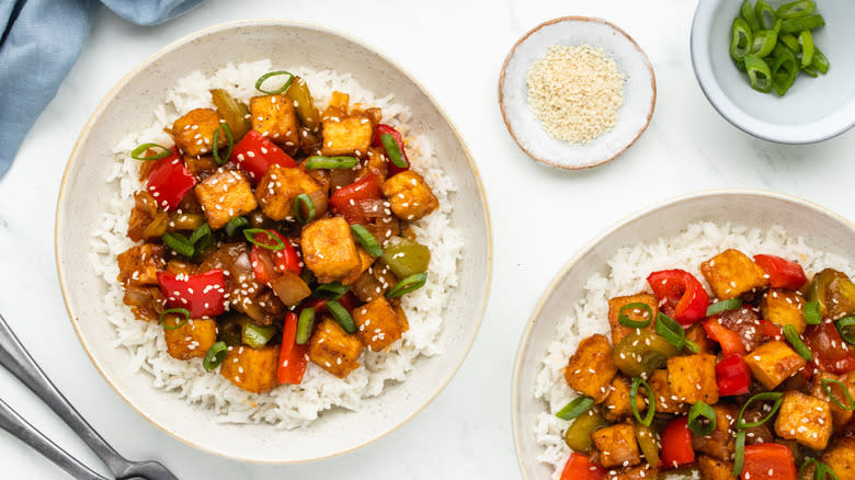 bowls of tofu and vegetables with rice