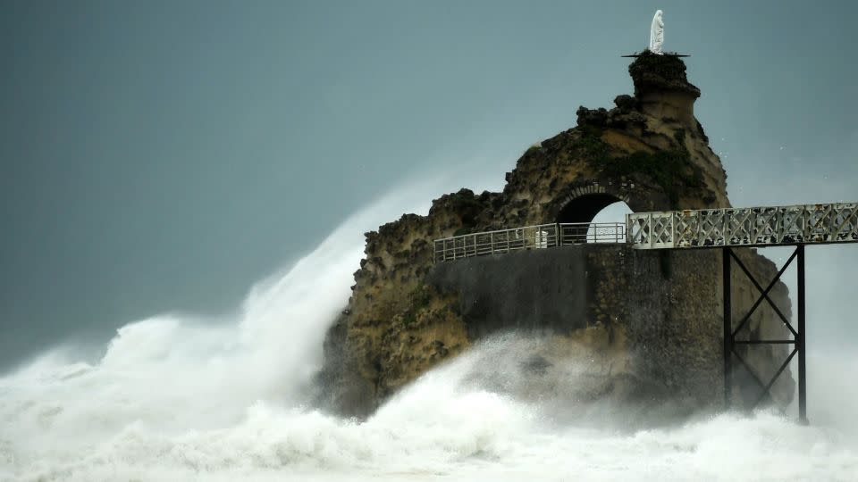 This photograph taken on November 3, shows waves crashing on the "Rocher de La Vierge" (Virgin Rock) as Storm Ciarán hits the region, in Biarritz, southwestern France. - Gaizka Iroz/AFP/Getty Images