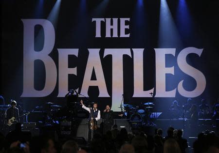 Paul McCartney (L) and Ringo Starr perform during the taping of "The Night That Changed America: A GRAMMY Salute To The Beatles", which commemorates the 50th anniversary of The Beatles appearance on the Ed Sullivan Show, in Los Angeles January 27, 2014. REUTERS/Mario Anzuoni