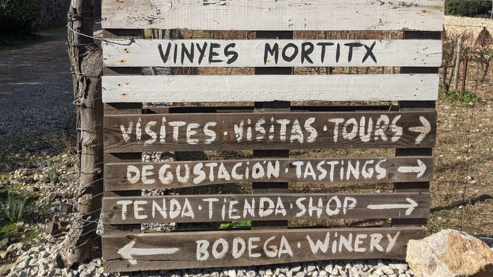 Wooden board at the entrance to a Mallorcan vineyard