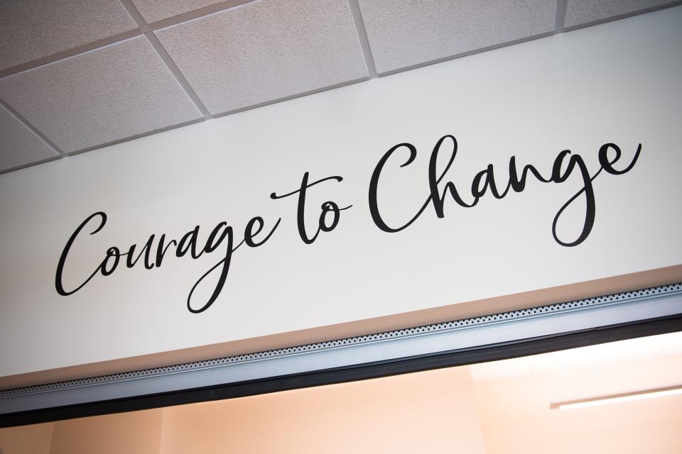 A sign at the Larimer County Community Corrections' women's residential facility reads "Courage to Change."