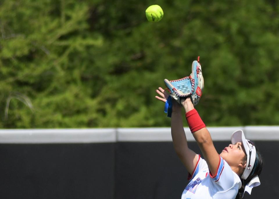 Monterey's Ava Lopez makes a catch in right field against Burleson Centennial in Game 2 of their Region I-5A semifinal series Saturday, May 21, 2022, at Poly Wells Field in Abilene.