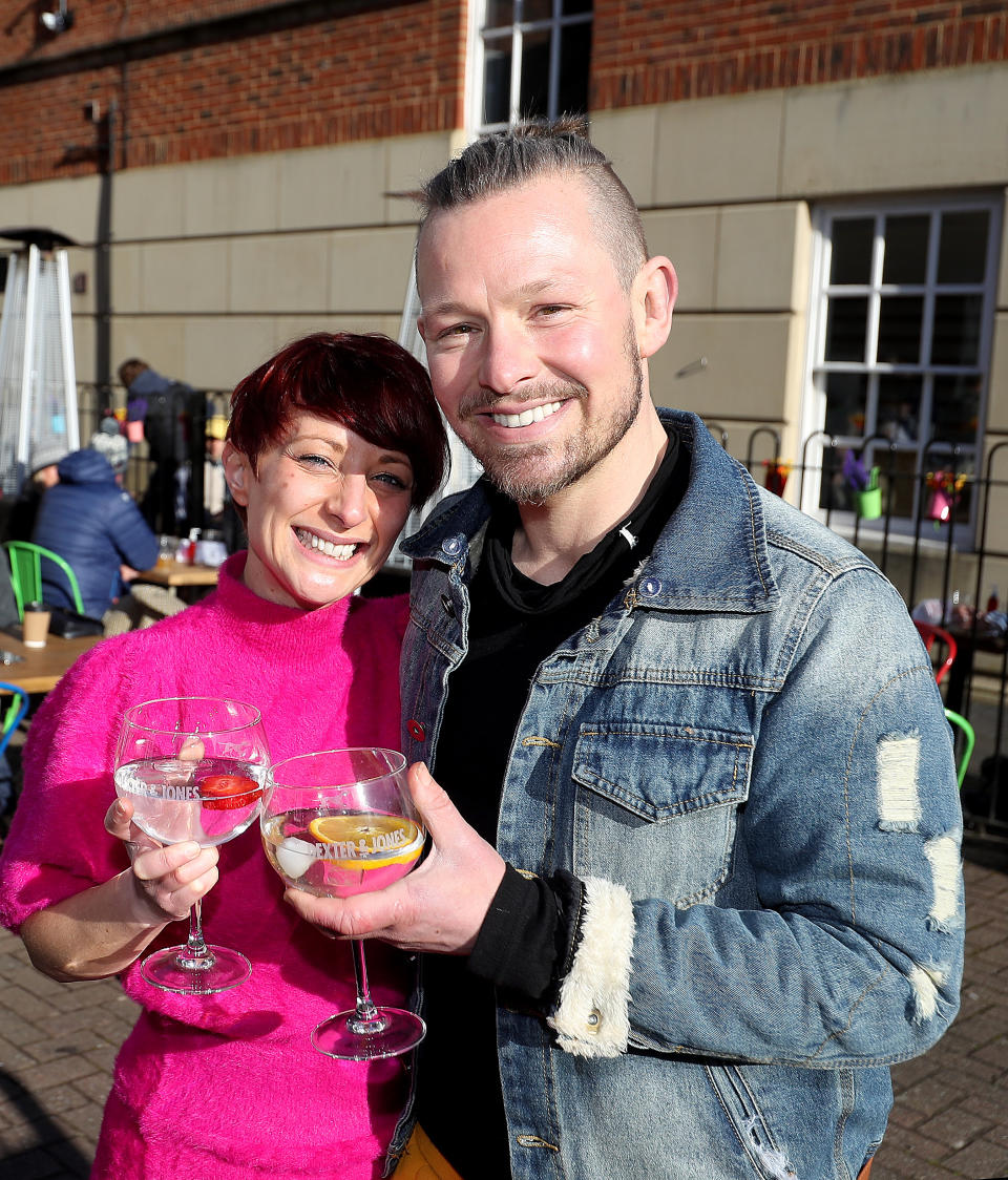 Bar owners Adam Rickitt and wife Katy welcome back customers to the Dexter and Jones gin bar in Knutsford, Cheshire, as England takes another step back towards normality with the further easing of lockdown restrictions. Picture date: Monday April 12, 2021. (Photo by Martin Rickett/PA Images via Getty Images)