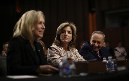 Caroline Kennedy (C), daughter of former U.S. President John F. Kennedy, listens to her supporter Senator Kirsten Gillibrand (D-NY) at Kennedy's U.S. Senate Foreign Relations Committee hearing on her nomination as the U.S. Ambassador to Japan, on Capitol Hill in Washington, September 19, 2013. REUTERS/Jason Reed