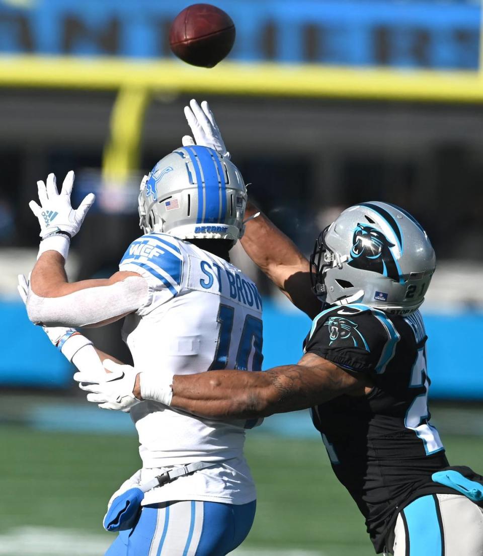 Carolina Panthers safety Jeremy Chinn, right, breaks up a pass meant for Detroit Lions wide receiver Amon-Ra St. Brown, left, during first quarter action at Bank of America Stadium on Saturday, December 24, 2022 in Charlotte, NC. JEFF SINER/jsiner@charlotteobserver.com