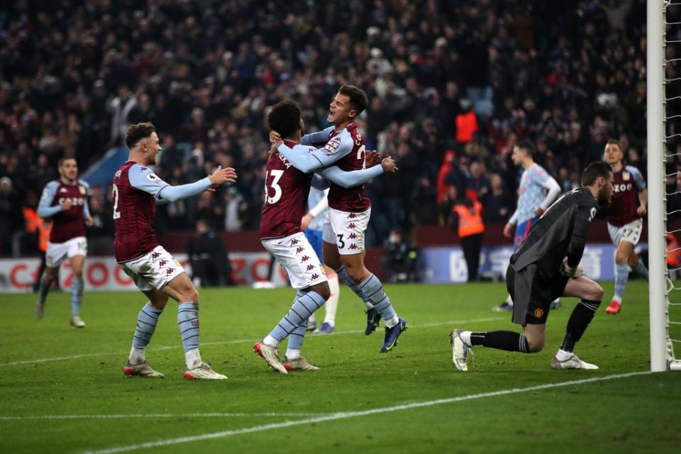 Philippe Coutinho is mobbed after an Aston Villa comeback stuns Manchester United (PA Wire)