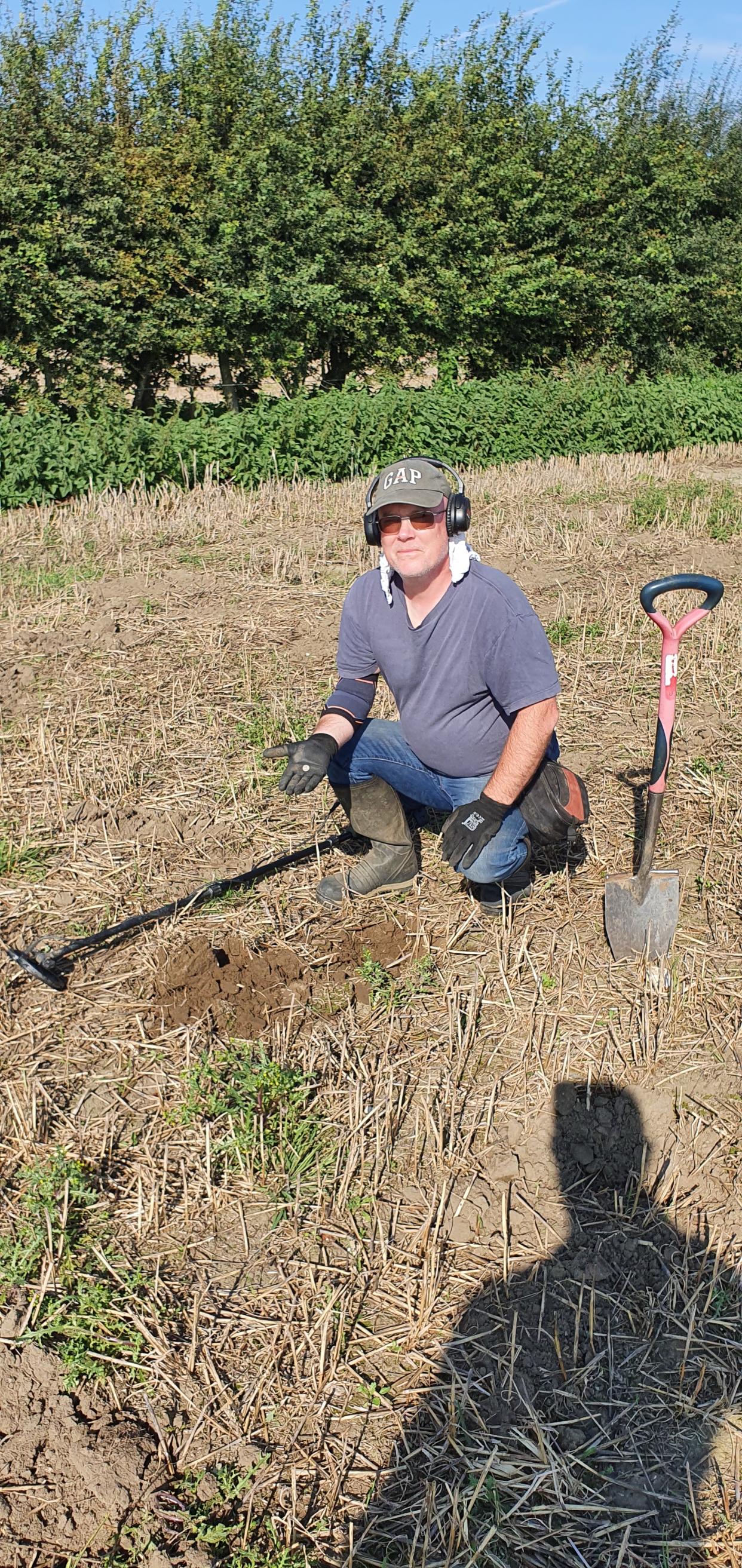 Carpenter Dave Allen from Essex helping dig up the Roman treasure found on their campsite. (Noonans)