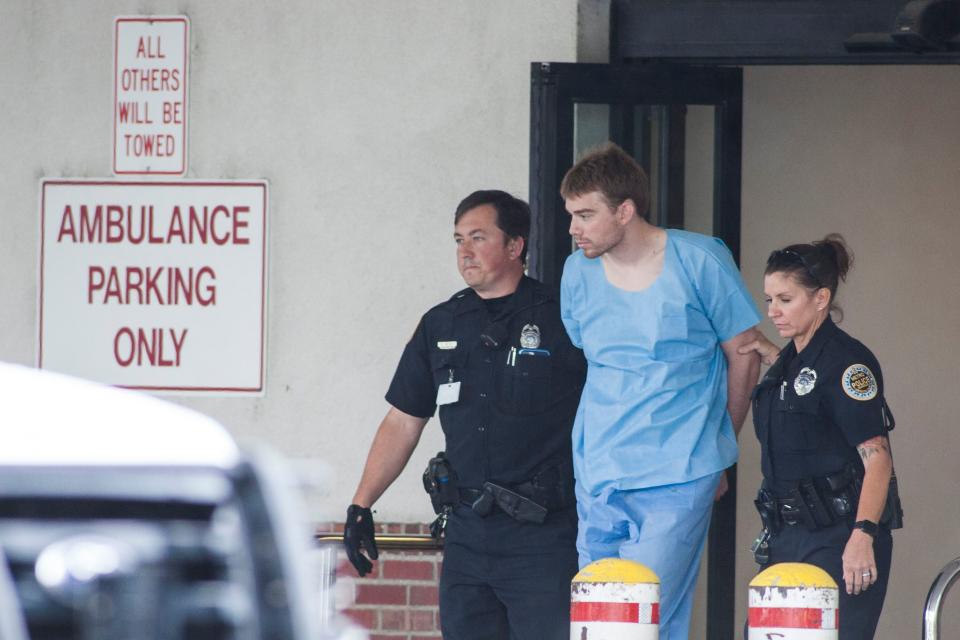 <p>Nashville Police officers escort Travis Reinking out of Metro General Hospital on the way to jail in Nashville, Tenn., April 23, 2018. (Photo: Rick Musacchio/EPA-EFE/REX/Shutterstock) </p>