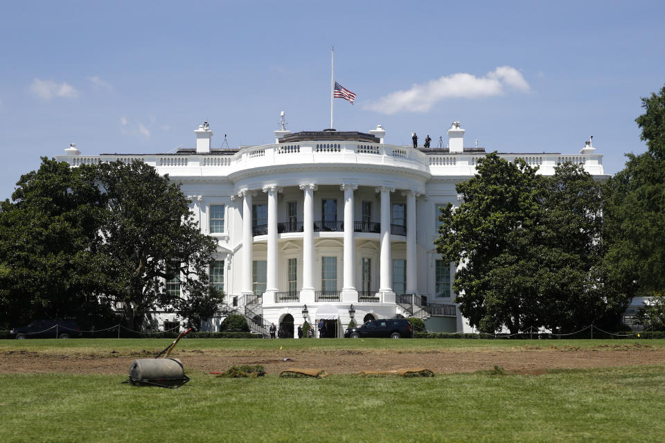 An American flag flies at half-staff over the White House in Washington, Saturday, July 18, 2020, in remembrance of Rep. John Lewis, D-Ga. Lewis, who carried the struggle against racial discrimination from Southern battlegrounds of the 1960s to the halls of Congress, died Friday. (AP Photo/Patrick Semansky)