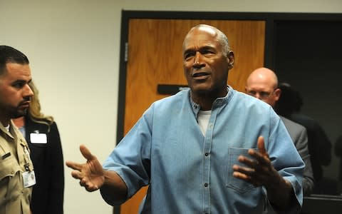 OJ Simpson reacts after learning he was granted parole - Credit: EPA