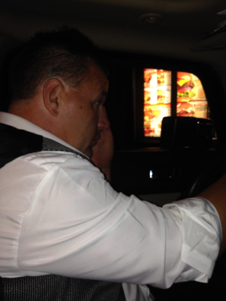 "My husband ordering at the drive-thru at Hardee's the night of our wedding. We were starving." 